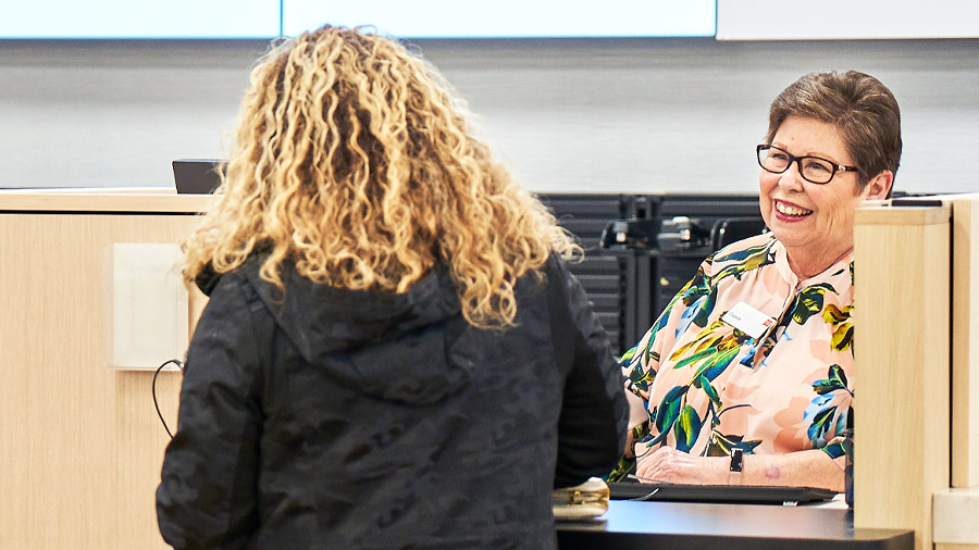 An employee interacts with a customer in a Wells Fargo branch.