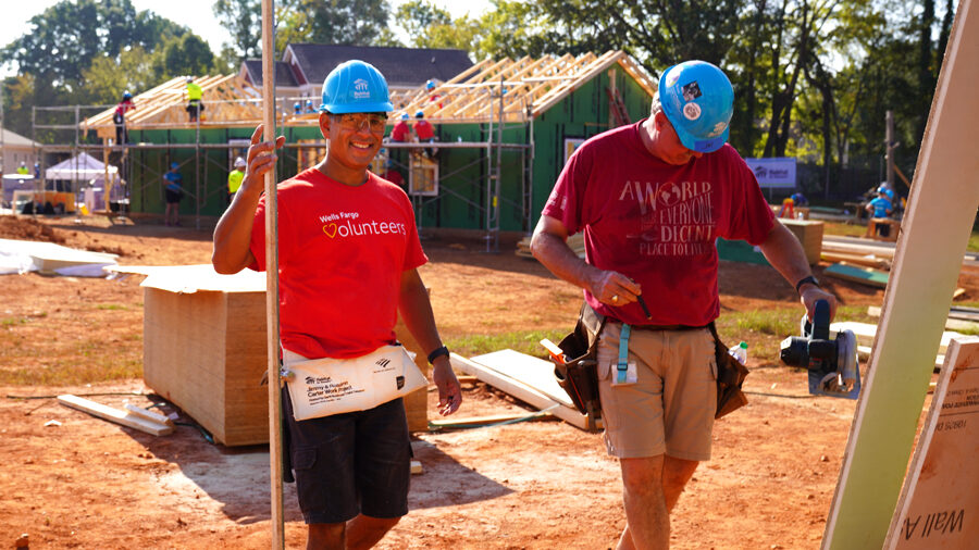 Two people working at a construction site.