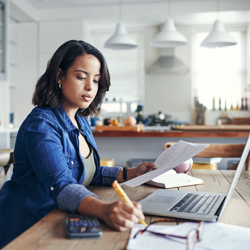 Woman reviewing tips to pay less taxes